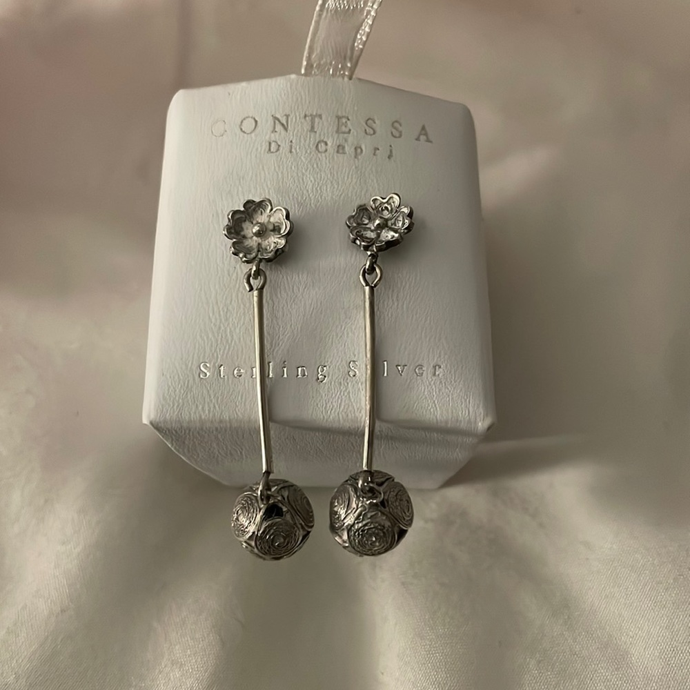 Silver earrings.